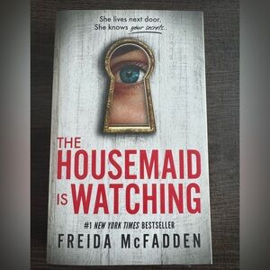 The Housemaid is Watching Coffee Table Book - Red and White Cover